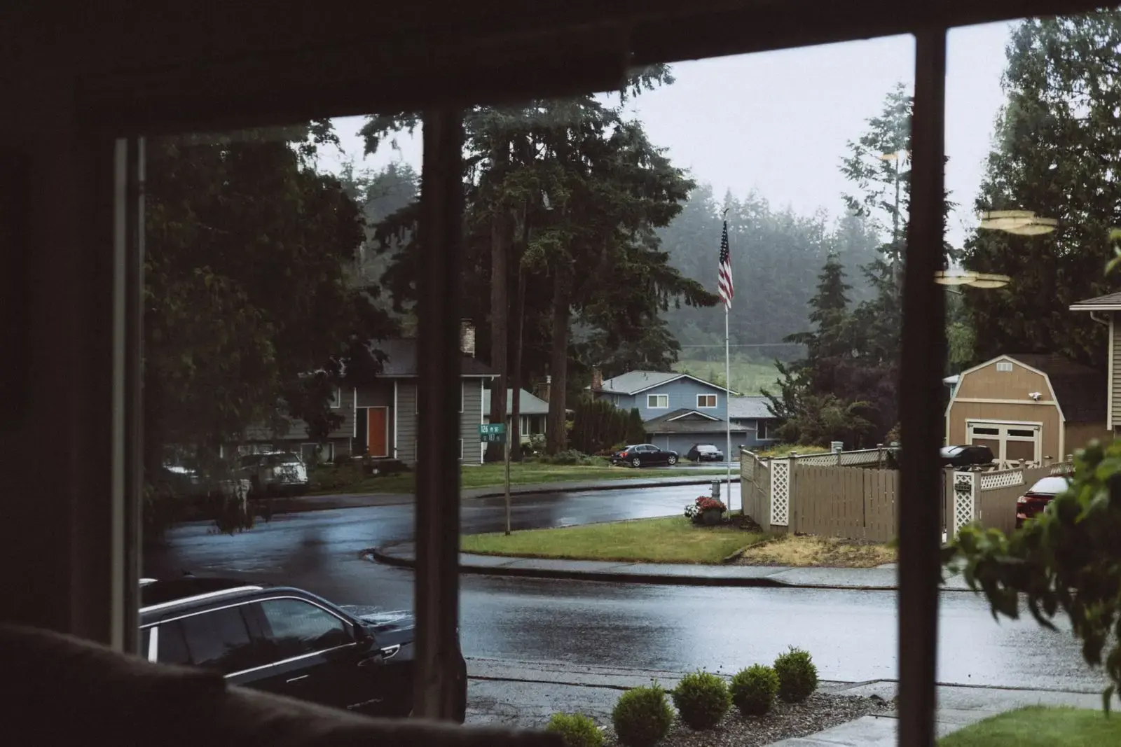 Suburban street on a rainy day seen through a window
